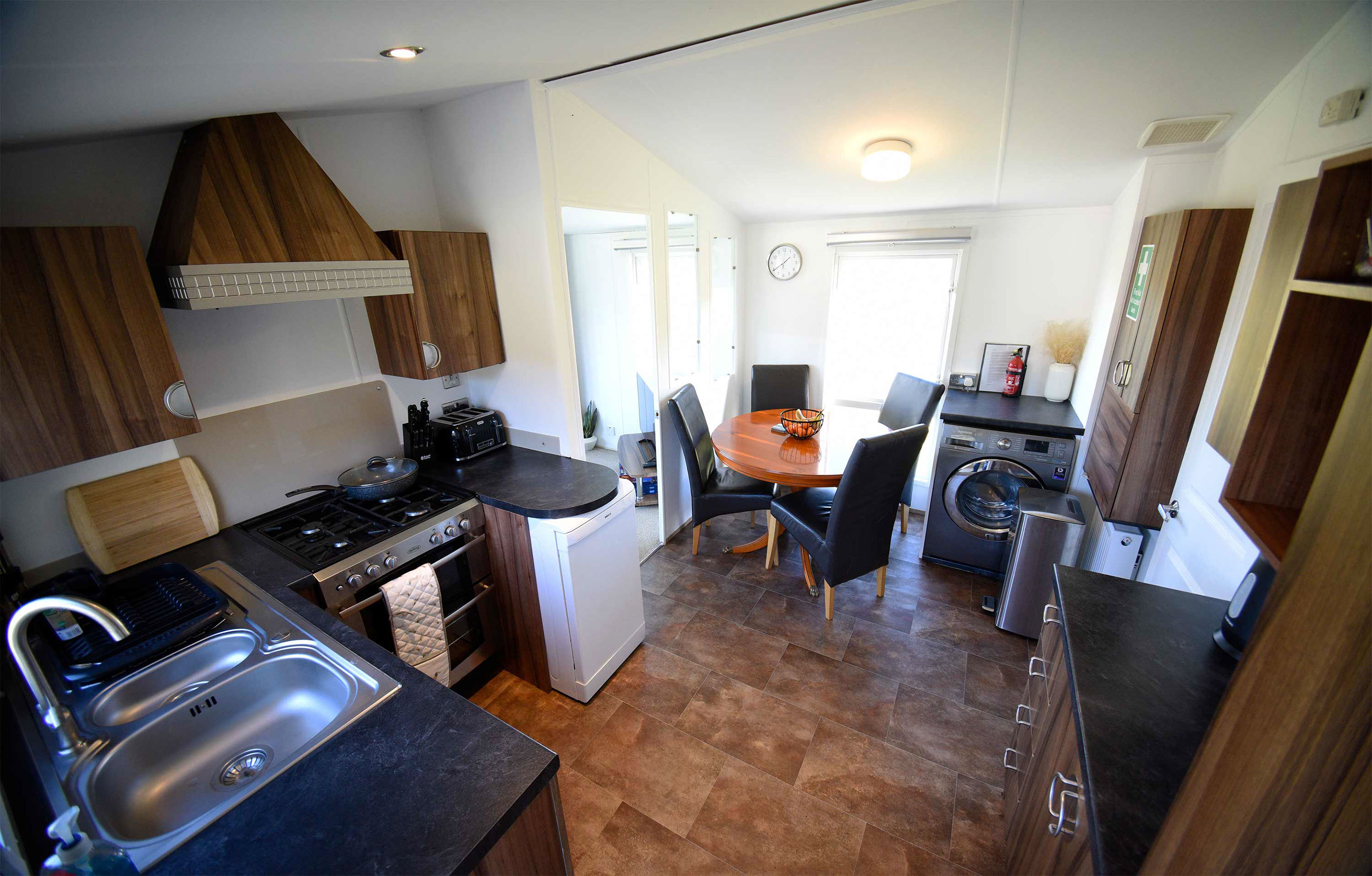 Storr self catering Caravan contains a modern kitchen with comfortable dining table