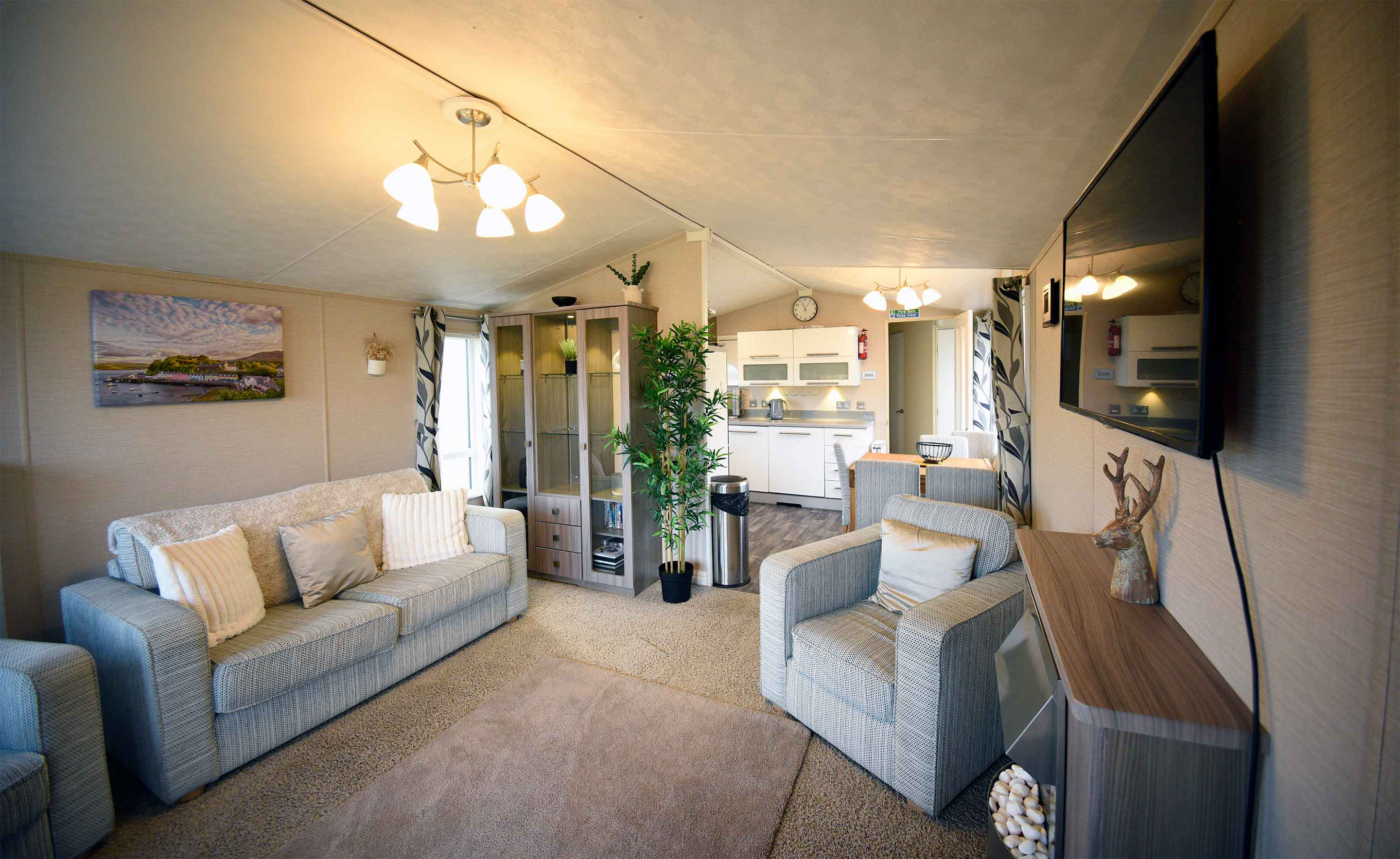 Stay in our Marsco Caravan with luxury living room and kitchen complimenting sea views